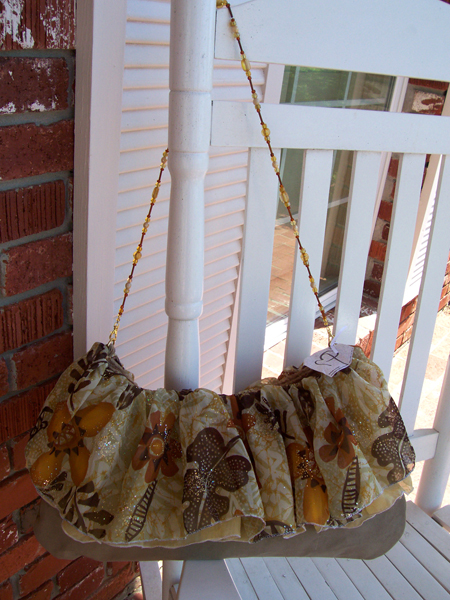 tan orange sparkle ruffled handbag